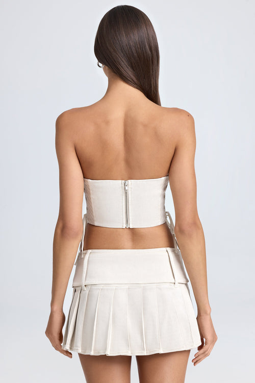 Belted Pleated Low-Rise Micro Mini Skirt in Ecru